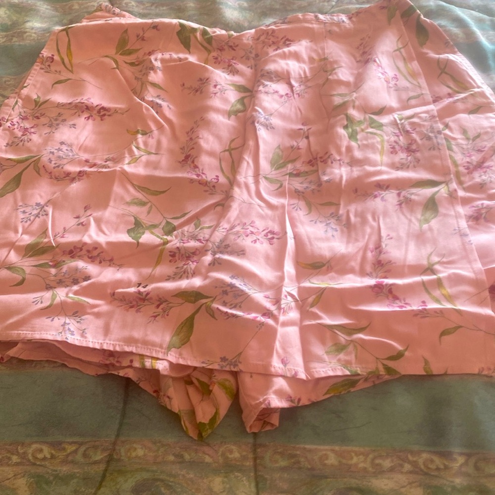 Skirt/short, brand Izod. Pink color with green and red print. Size 14.